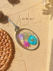 Resin Pendant Necklace With Larkspur Blue Galsang Flower