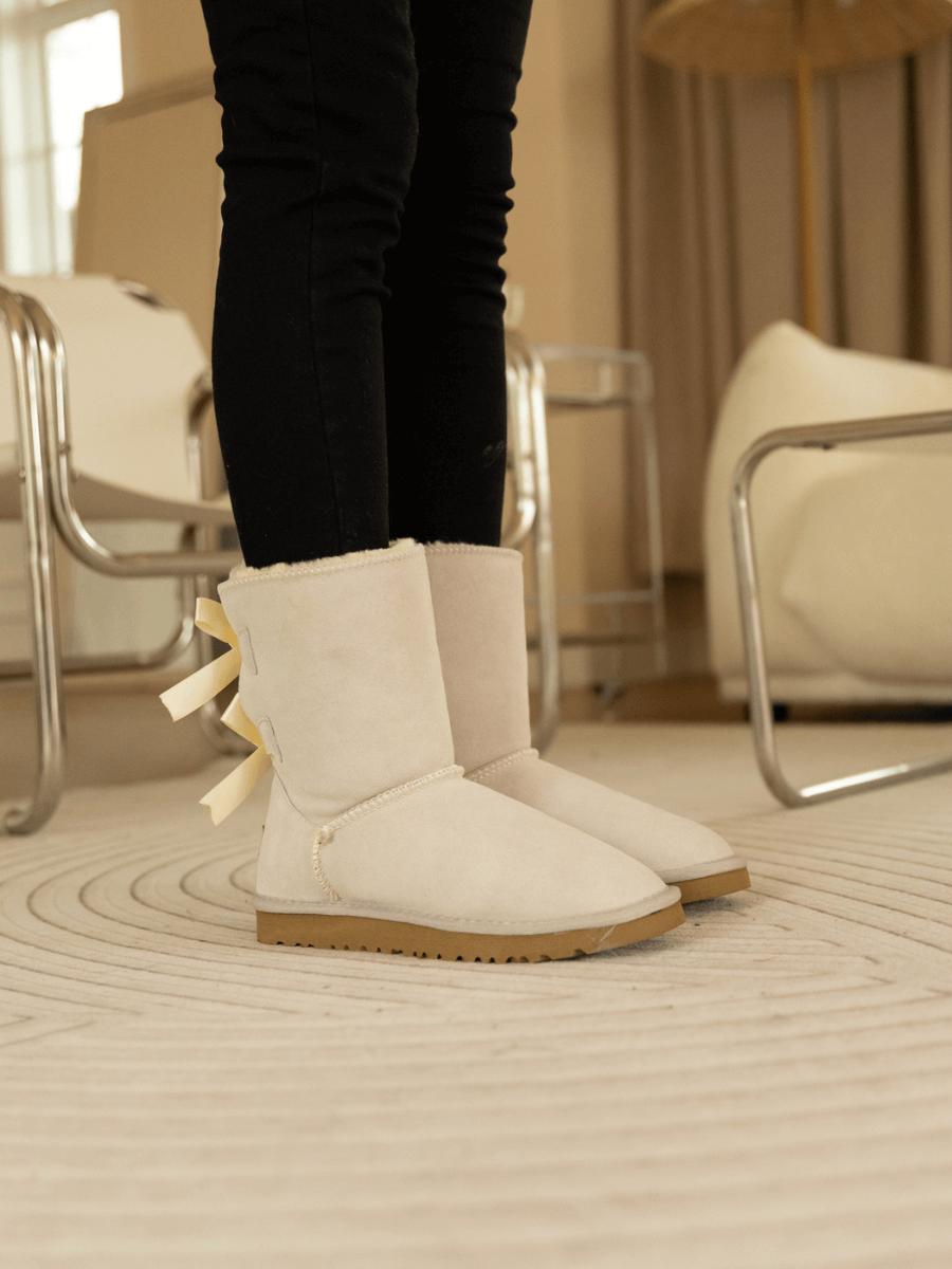 Smaibulun Ugg | Double Ballet Ribbon Bow Suede Shearling Boots - Ivory