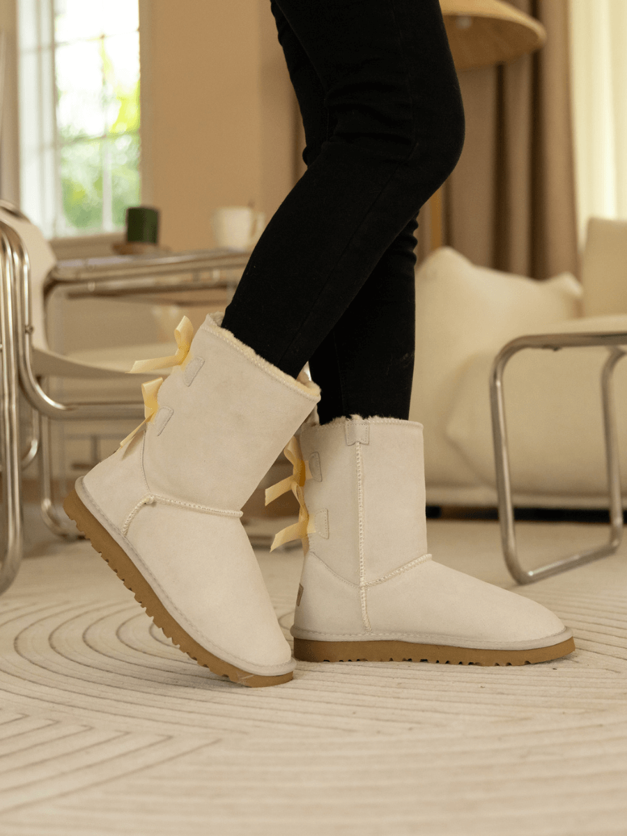 Smaibulun Ugg | Double Ballet Ribbon Bow Suede Shearling Boots - Ivory