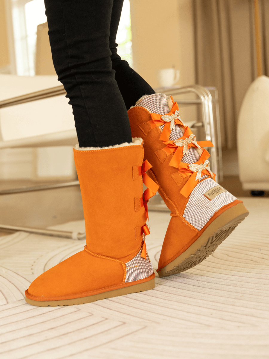 SMAIBULUN Ugg | Rhinestone Ribbon Tri-Tie Bow Suede Boots - Orange