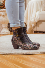 SOFFIA | FLORAL BUTTON-ACCENT BLACK LEATHER ANKLE BOOT