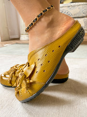 Rumour Has It | Flower Tassel Perforated Accent Leather Mules - Yellow